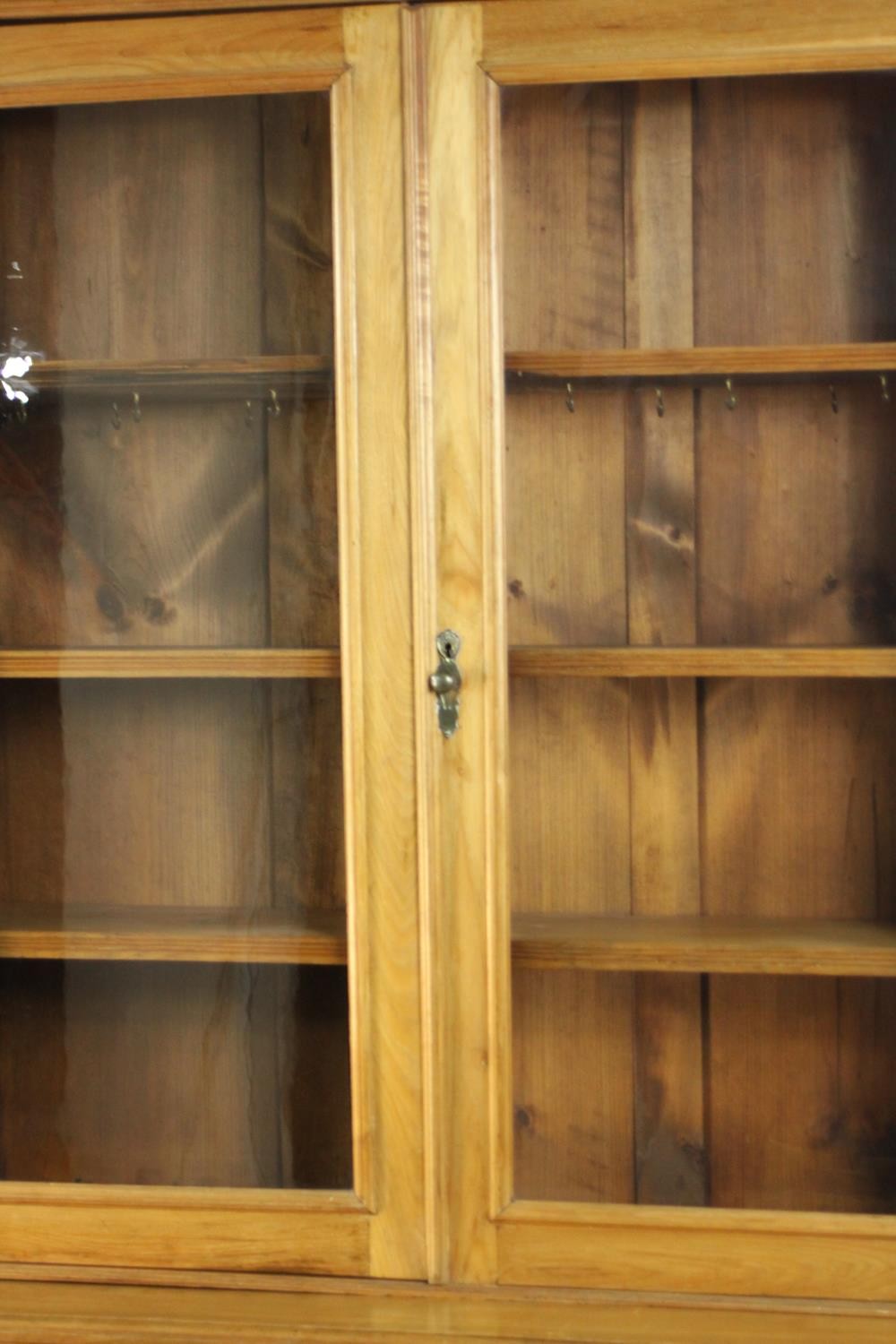 A Victorian style walnut bookcase, the two glazed doors enclosing shelves, over two short drawers - Image 3 of 11