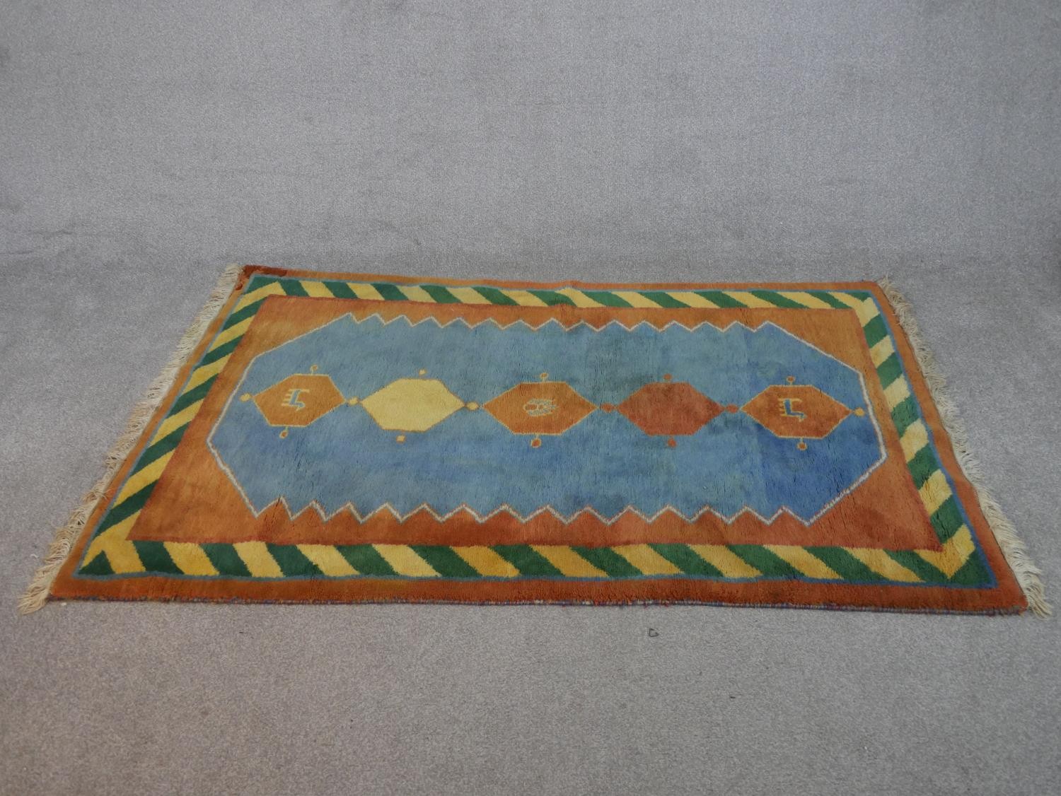 A blue ground hand made Persian Gabbeh rug. L.182 W.120cm