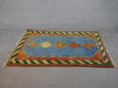 A blue ground hand made Persian Gabbeh rug. L.182 W.120cm