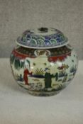 A large early 20th century Chinese hand painted ceramic urn with lid. The urn decorated with a