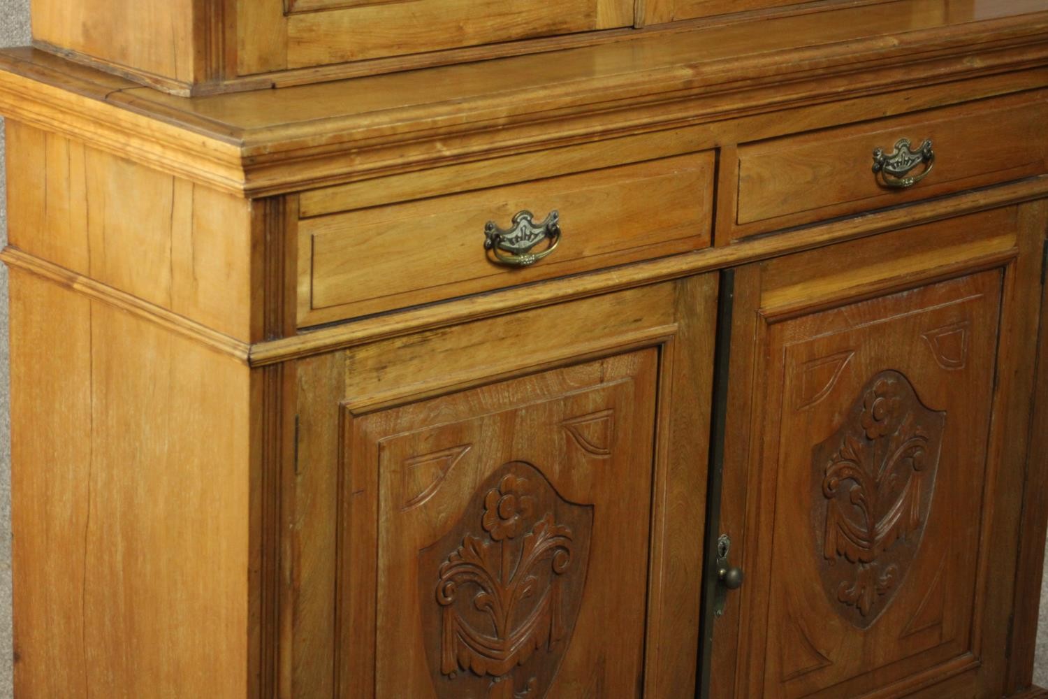 A Victorian style walnut bookcase, the two glazed doors enclosing shelves, over two short drawers - Image 11 of 11