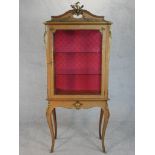 A French Louis XV style kingwood vitrine, with cast gilt metal furniture mounts, the glazed cupboard