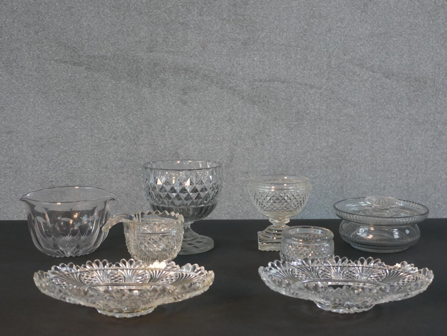 A collection of Georgian and early Victorian cut glass and crystal, including a petal faceted wine