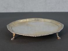 An Edwardian sterling silver mint tray on four hooved feet with rope effect border. Hallmarked: