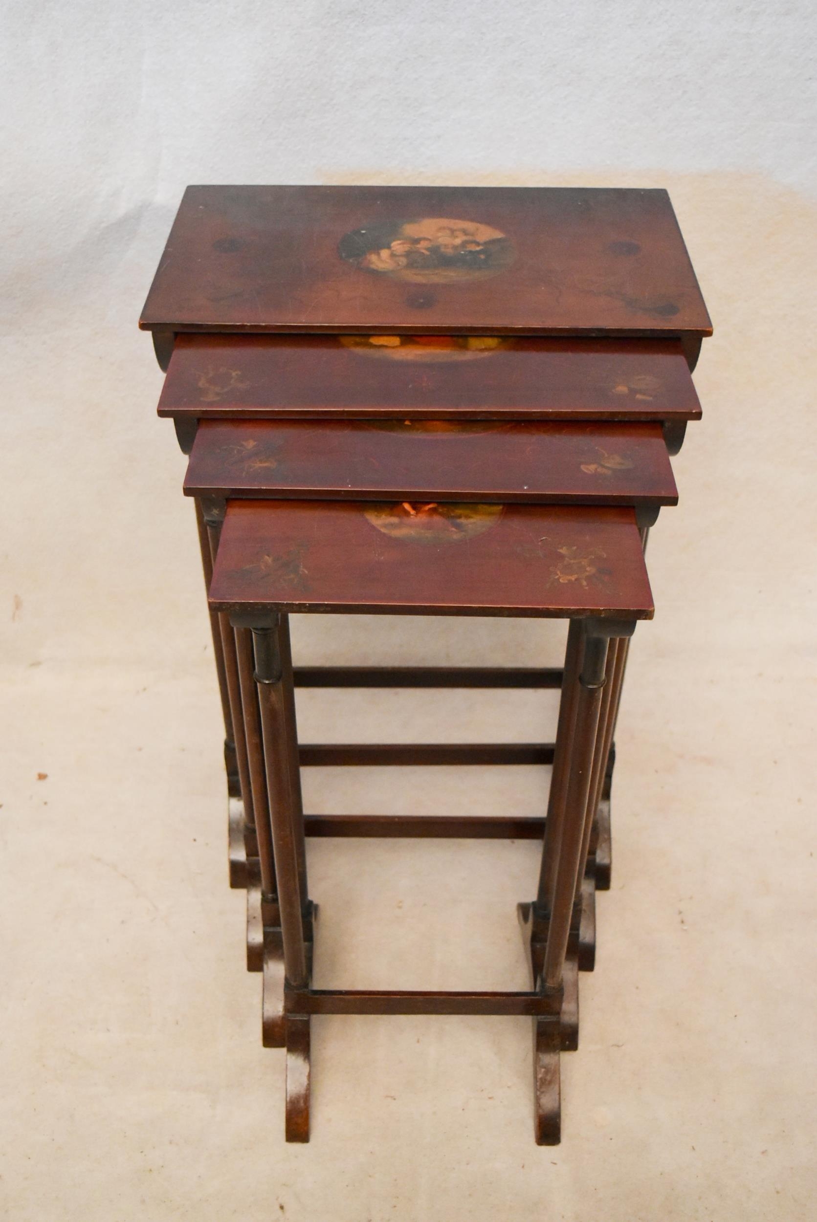 A quartetto nest of Regency style mahogany tables, each with rectangular tops hand painted with a