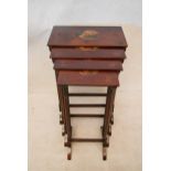 A quartetto nest of Regency style mahogany tables, each with rectangular tops hand painted with a