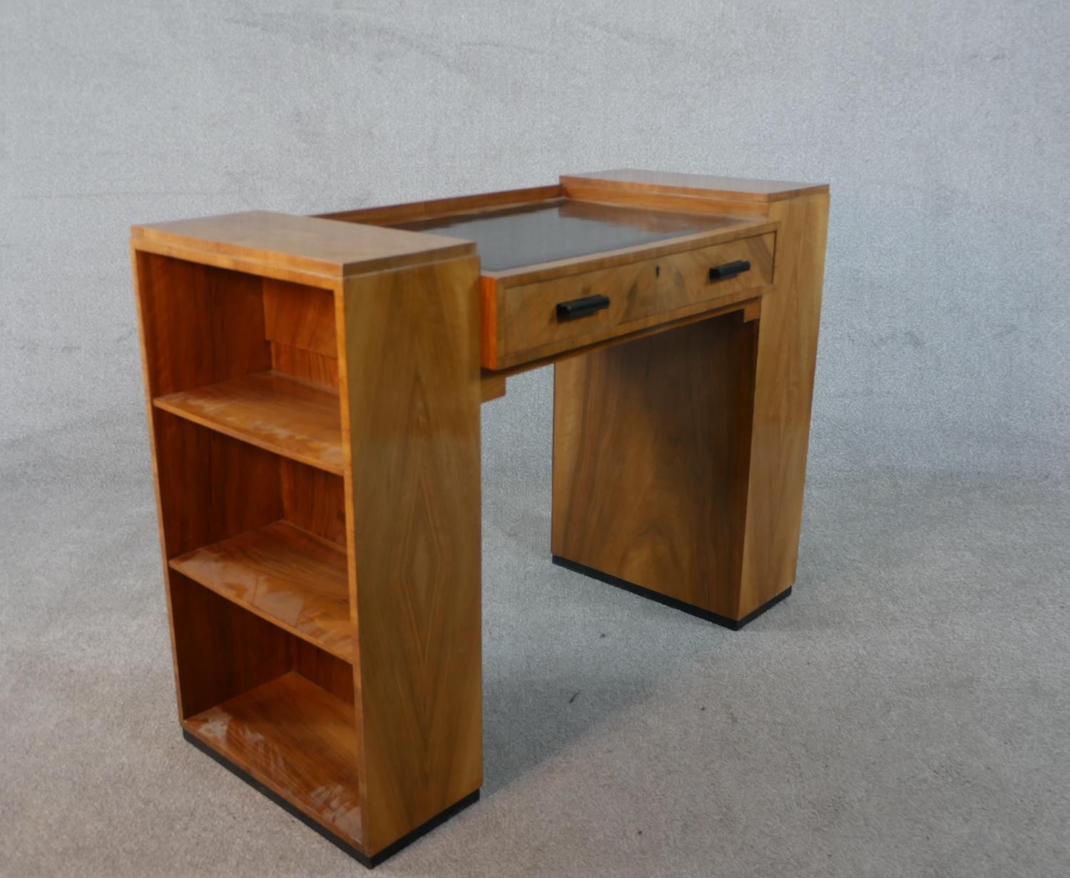 An Art Deco quarter veneered walnut desk with open bookshelves to each pedestal by Maple and Co. H. - Image 5 of 6