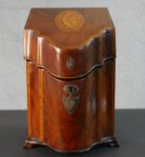 A 19th century flame mahogany and satin wood inlaid knife box with a white metal shield shape
