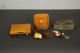 A collection of boxes and other items, including a meerschaum pipe in the form of a man in a turban,
