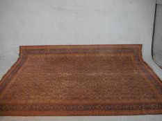 A red ground Keshan motif carpet. L.290 W.195cm