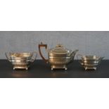 A Georgian silver three piece tea set by Daniel Pontifex with gadrooned design and repousse