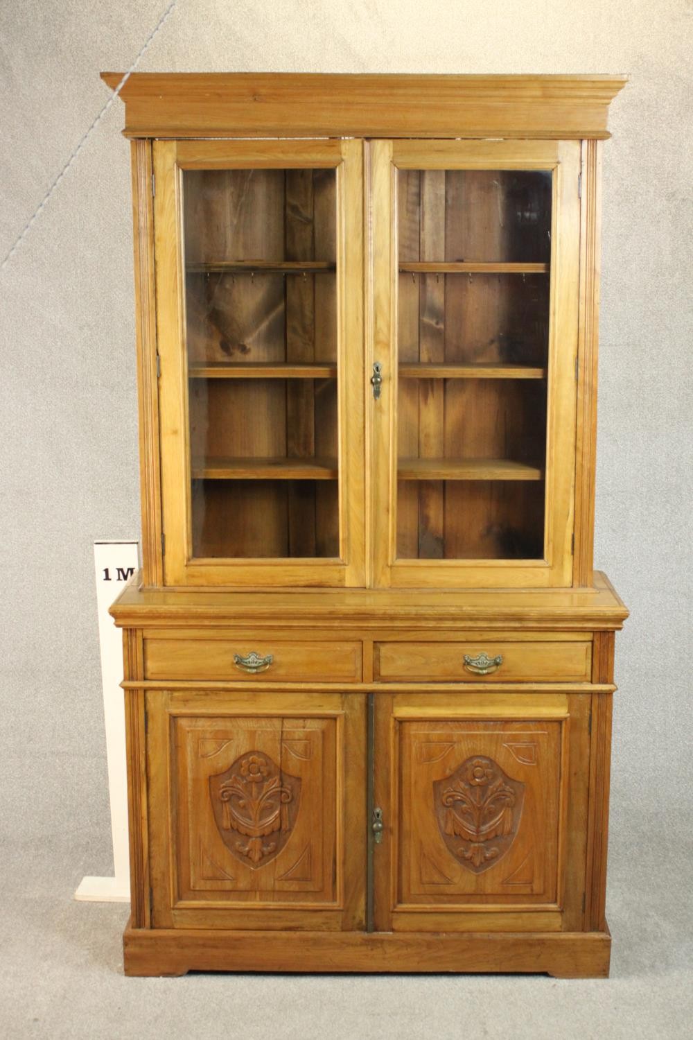 A Victorian style walnut bookcase, the two glazed doors enclosing shelves, over two short drawers - Image 2 of 11