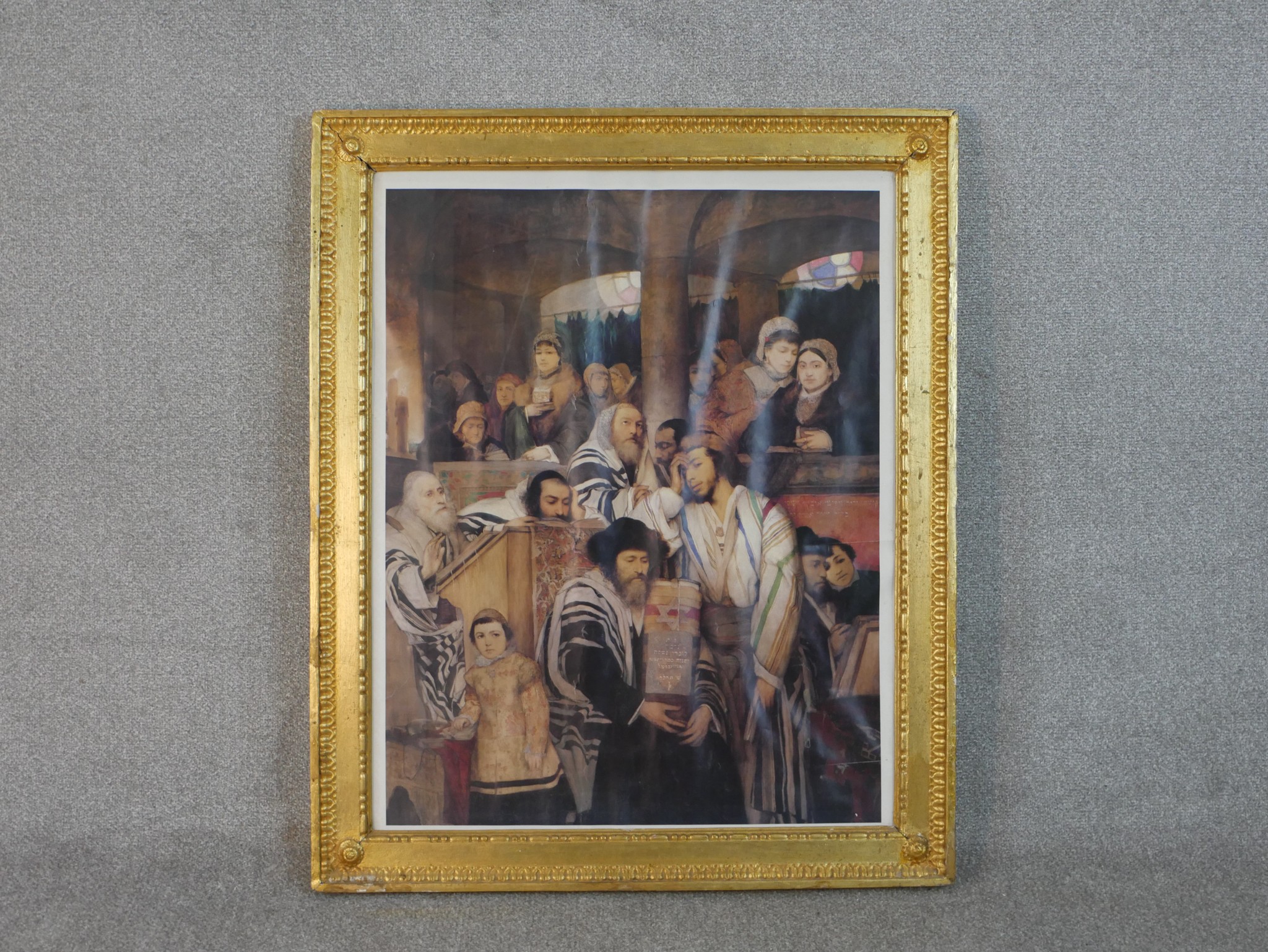 After Maurycy Gottlieb (1856 - 1879), a gilt framed coloured lithograph, congregation praying in a - Image 2 of 5