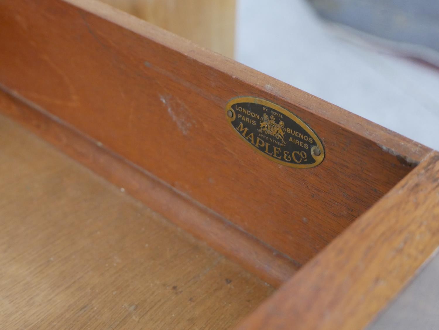 An Art Deco quarter veneered walnut desk with open bookshelves to each pedestal by Maple and Co. H. - Image 4 of 6