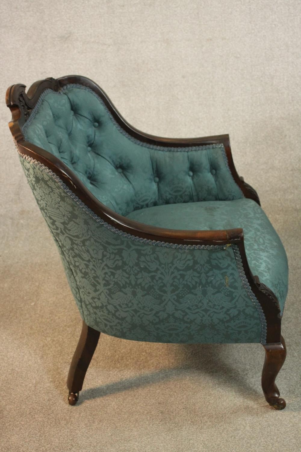 A pair of Edwardian walnut tub armchairs, upholstered in buttoned blue damask, with scrolling arms - Image 6 of 10