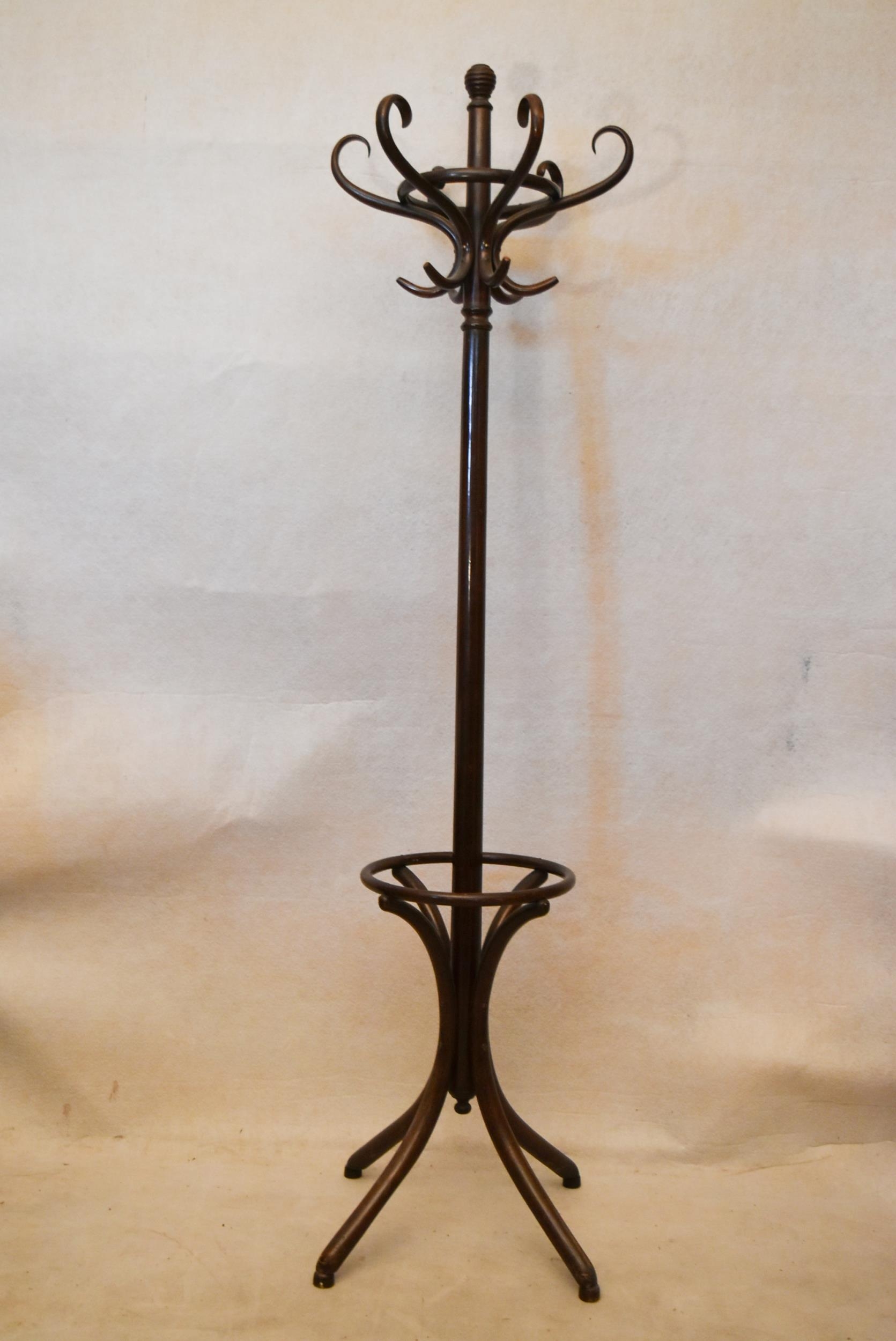 An early 20th century bentwood hat and coat stand, with six S shaped hooks, on four curved feet.