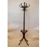 An early 20th century bentwood hat and coat stand, with six S shaped hooks, on four curved feet.