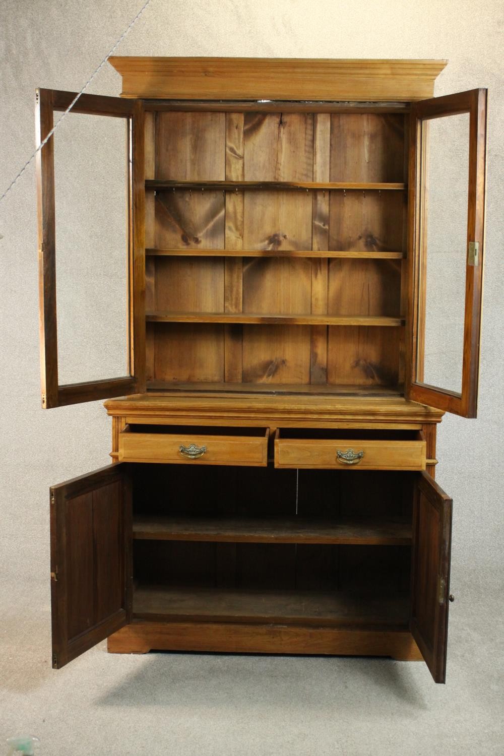 A Victorian style walnut bookcase, the two glazed doors enclosing shelves, over two short drawers - Image 6 of 11