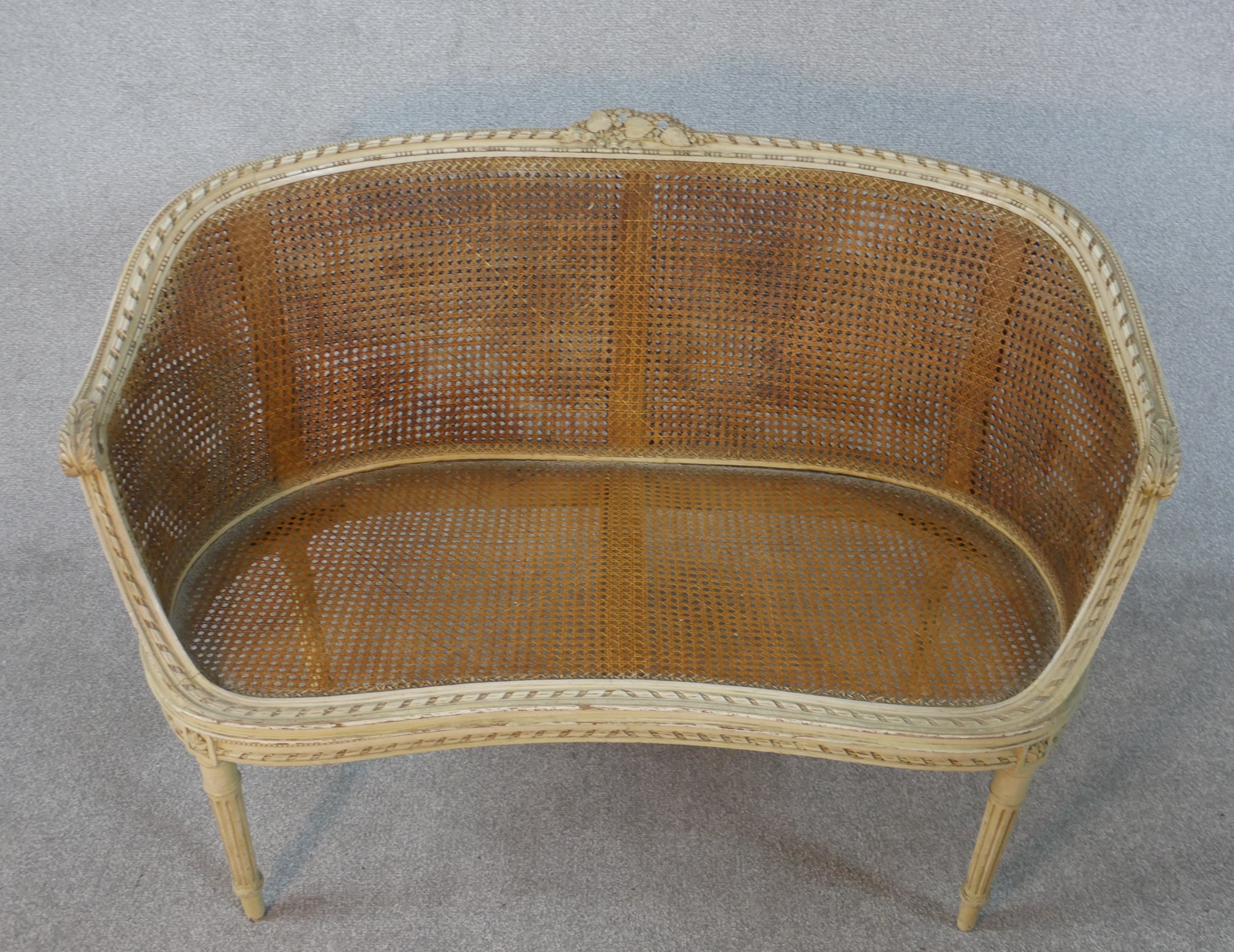 A French Louis XVI style painted canape sofa, with double caned back and sides, and loose cushions - Image 6 of 7