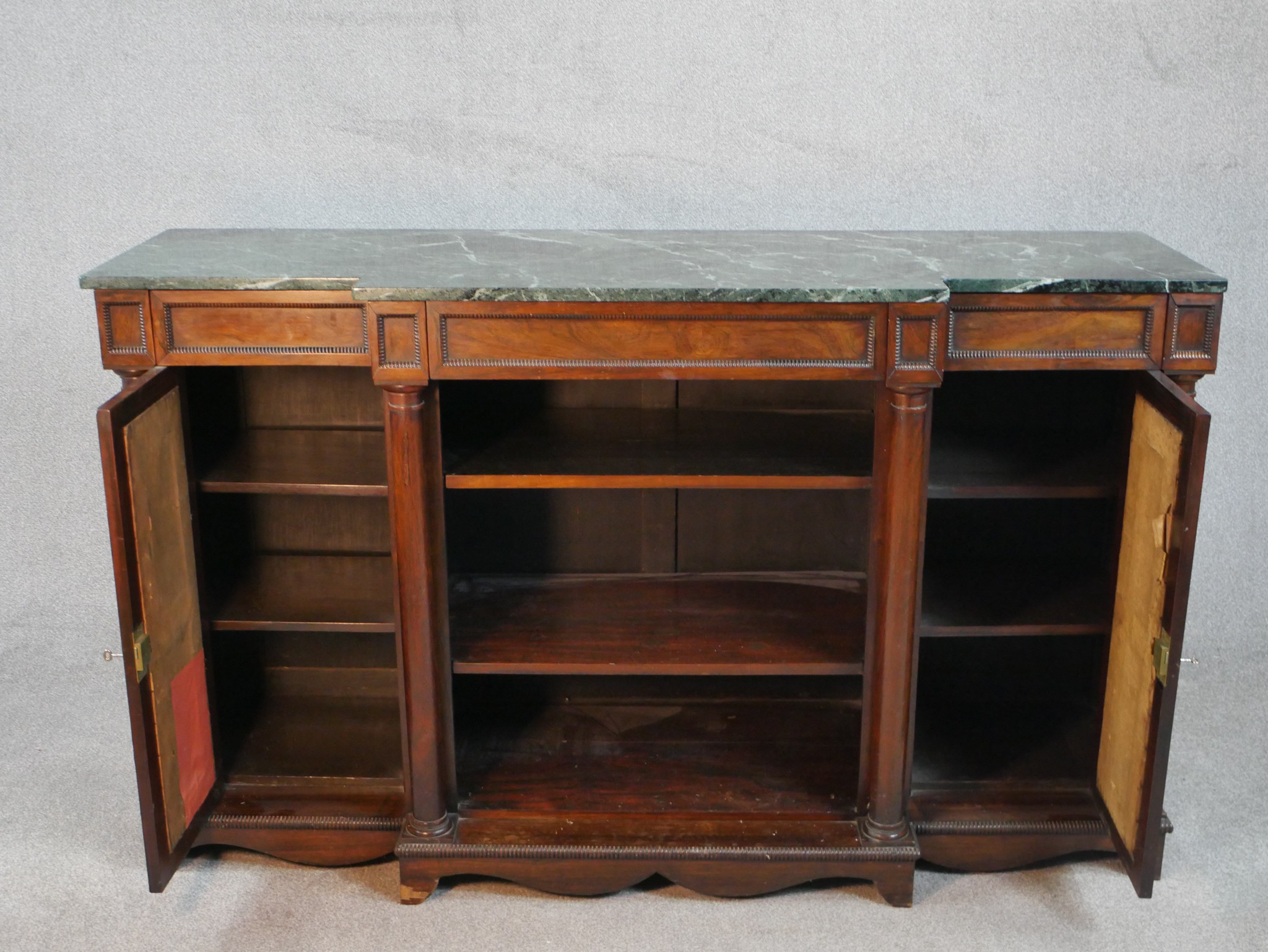 A William IV walnut breakfront sideboard, with a green marble top supported by four columns, with - Image 3 of 7