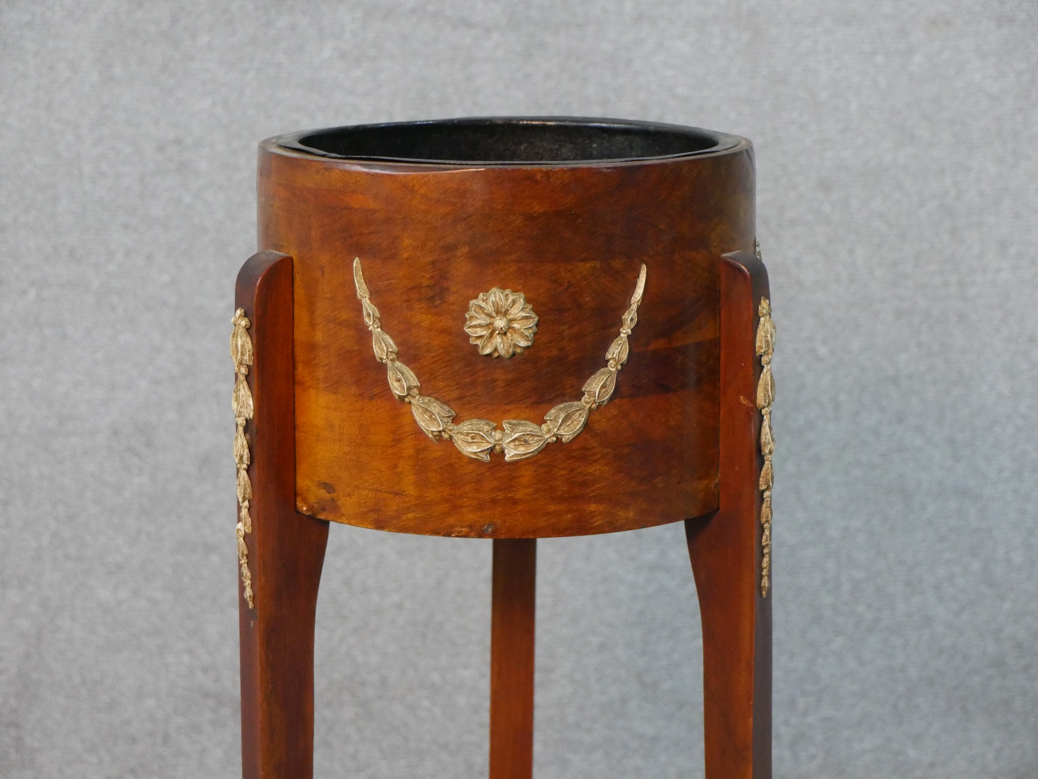 A 20th century fruitwood jardiniere stand, the circular top with gilt metal mounts, on three splayed - Image 2 of 5