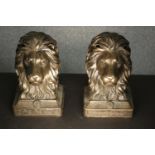 A pair of bronze male lion head bookends. H.19 W.10 D.13cm. (each)