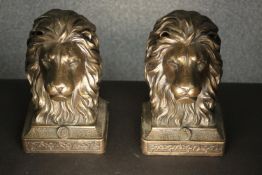 A pair of bronze male lion head bookends. H.19 W.10 D.13cm. (each)