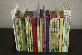 A collection of twenty three vintage Rupert Bear annuals and other vintage Rupert Bear books. L.29