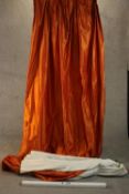 A pair of silk mix burnt orange fully lined curtains. L.312 W.200cm. (each)