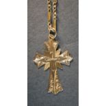 A yellow metal (tests as 14 carat) engraved crucifix pendant and fancy link chain with C-sprung