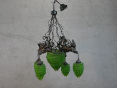 A spelter cherub and green glass grape design chandelier, with central large bunch of grapes with