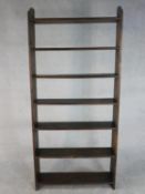 A late 20th century stained pine open bookcase, with seven shelves. H.200 W.92 D.22cm