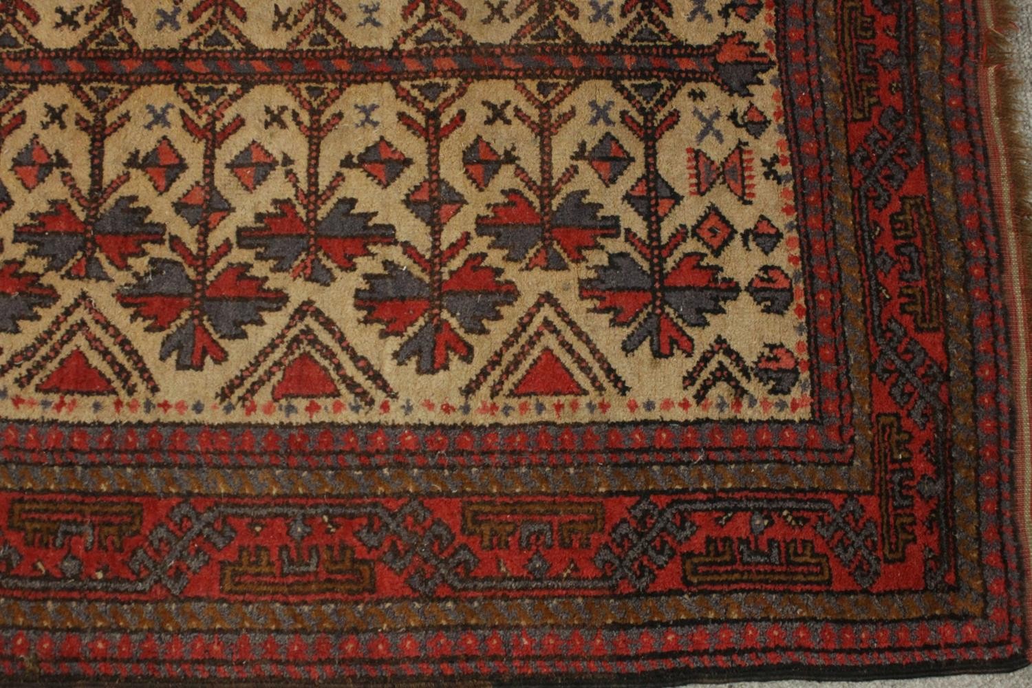 A beige ground hand made Belouch rug. L.180 W.102cm. - Image 5 of 5