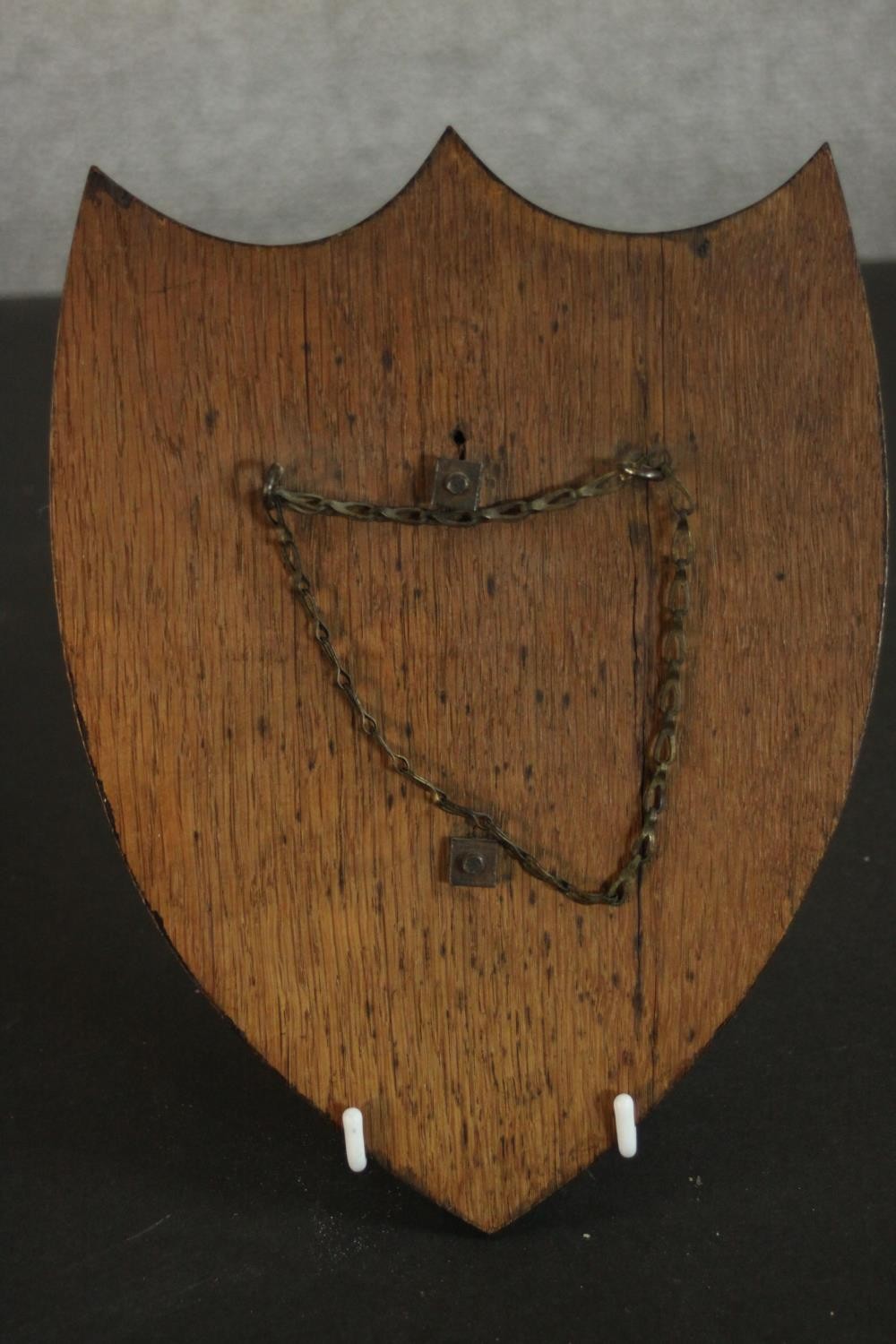 An early 20th century oak heraldic shield with hand painted metal panel to centre with open book and - Image 5 of 7