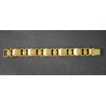 An 18 carat Egyptian yellow gold engraved articulated bracelet, each section engraved with a