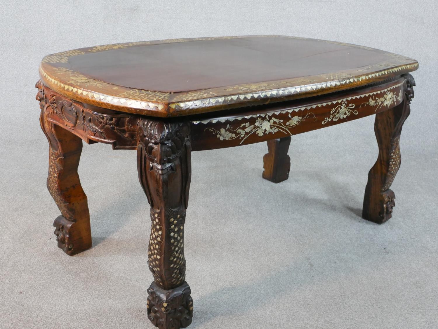 An early 20th century Chinese hardwood table with carved figural legs, all over inlaid with a mother - Image 8 of 8