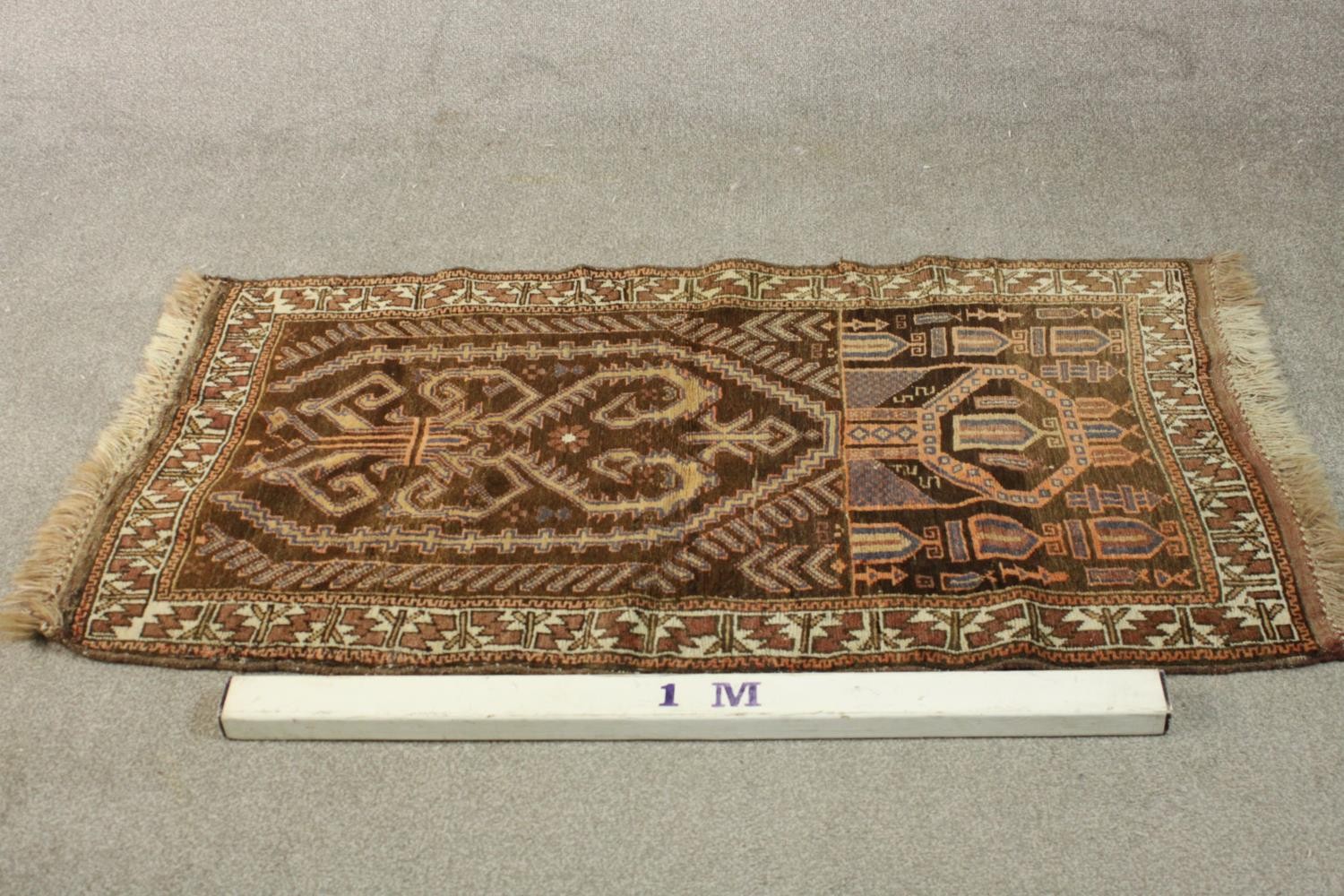 A hand made mocha ground Belouch rug. L.152 W.79cm. - Image 2 of 4