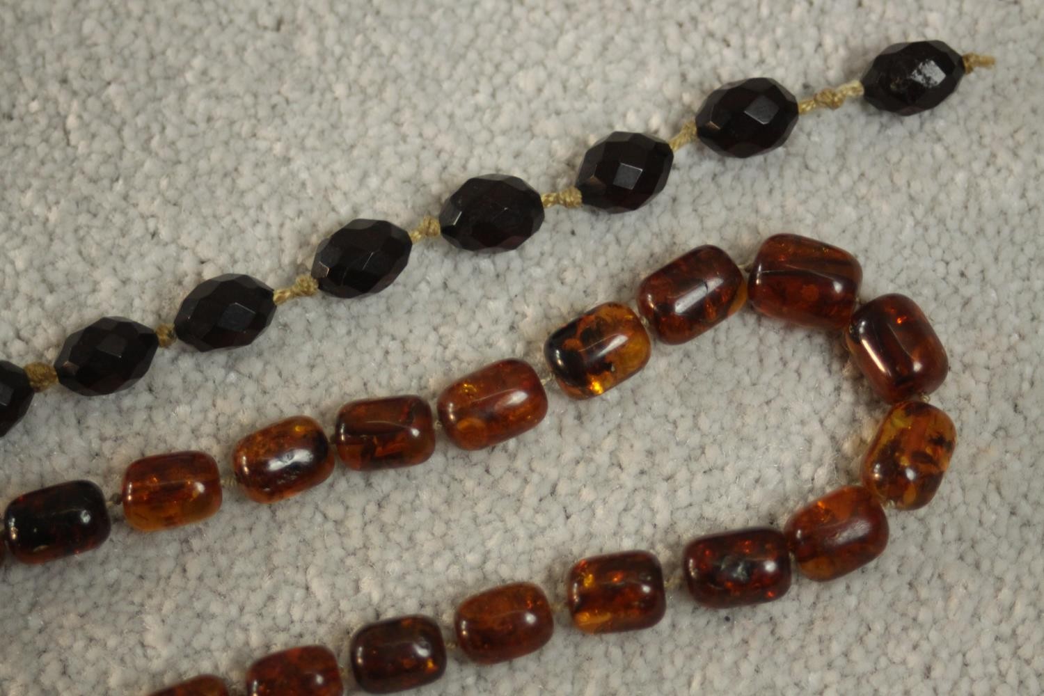 A vintage graduated Baltic amber bead necklace with a screw barrel clasp (damaged) along with a - Image 3 of 5