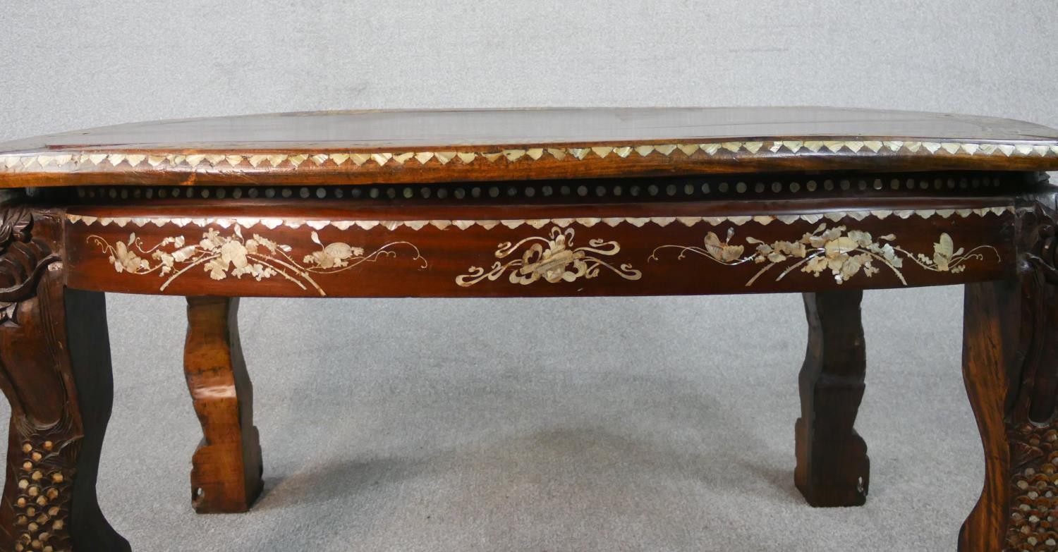 An early 20th century Chinese hardwood table with carved figural legs, all over inlaid with a mother - Image 6 of 8