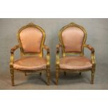 A pair of Louis XVI style giltwood fauteuil armchairs, upholstered in pink fabric to the back,