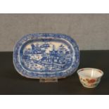 A 18th century Famille Rose tea bowl with floral design along with a blue and white Chinese hand