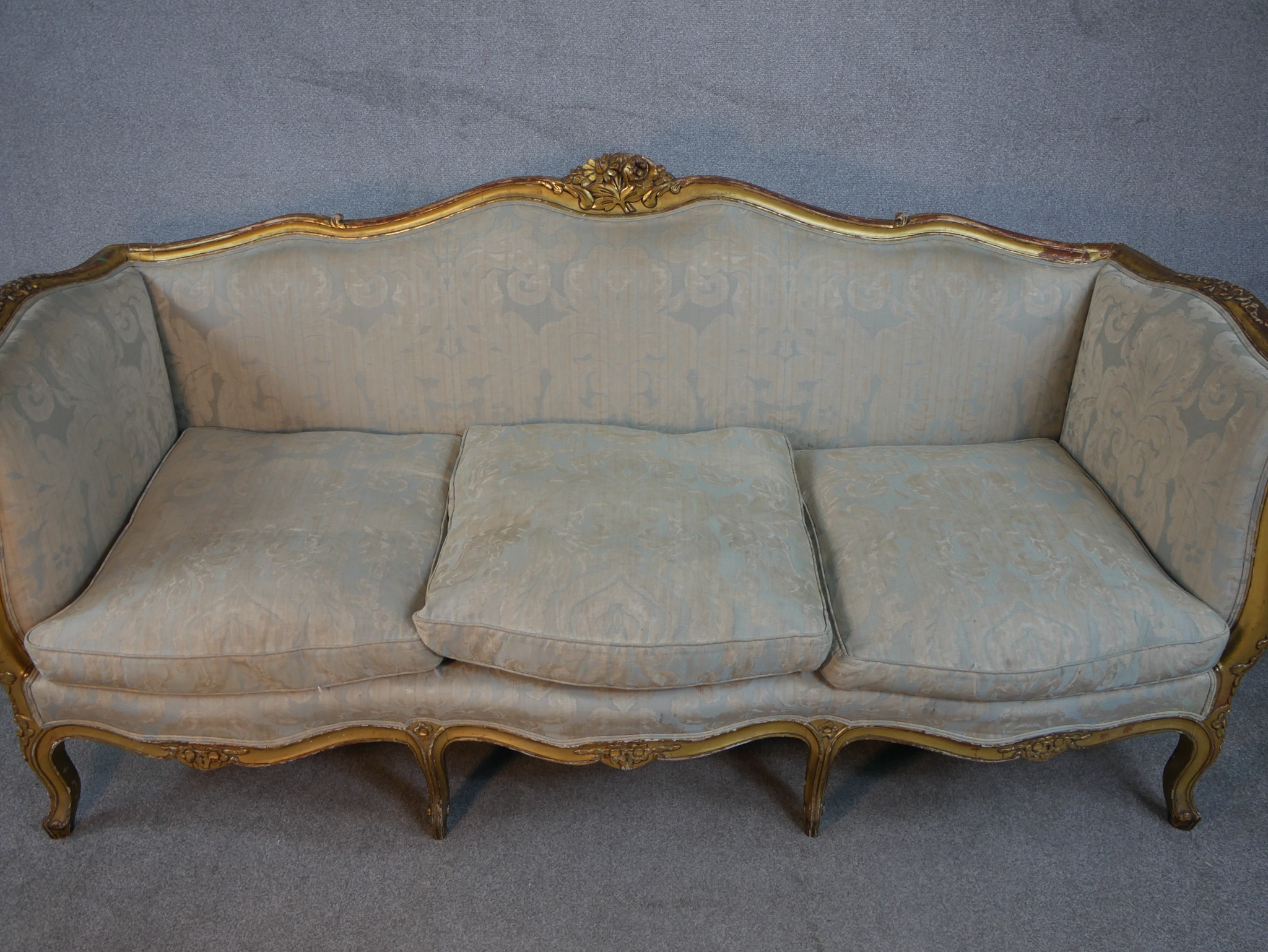 A carved giltwood Louis XV style sofa in floral upholstery on cabriole supports. H.102 W.208 D.76cm - Image 2 of 8