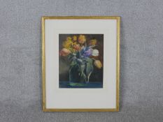 A framed and glazed watercolor of a vase of tulips, label verso. H.62 W.50cm