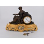 A French gilt ormolu and spelter Classical lady design mantle clock on a gilt pierced foliate