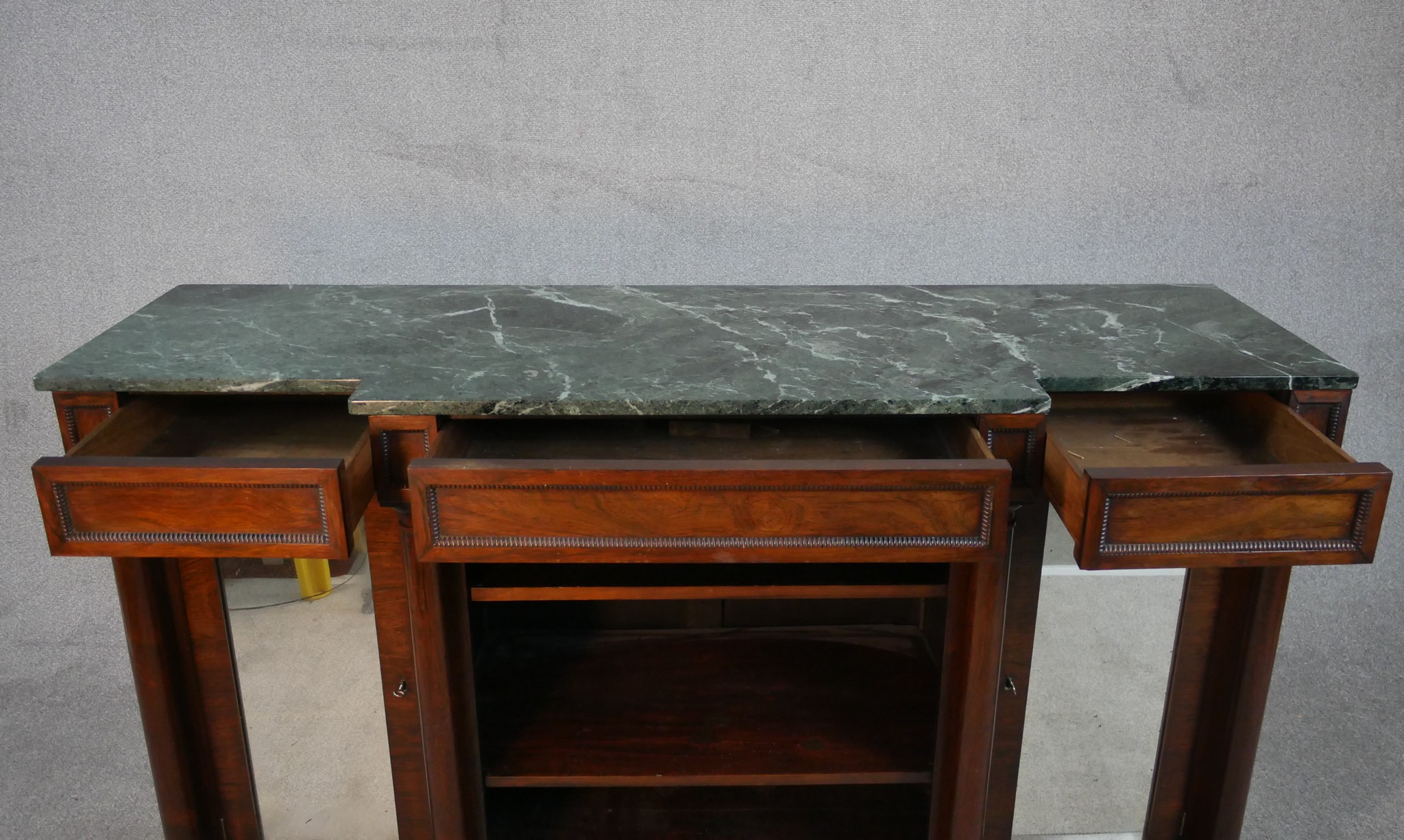 A William IV walnut breakfront sideboard, with a green marble top supported by four columns, with - Image 5 of 7