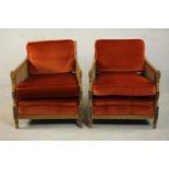 A pair of Edwardian Adam inspired mahogany bergere armchairs, upholstered in red velour with loose