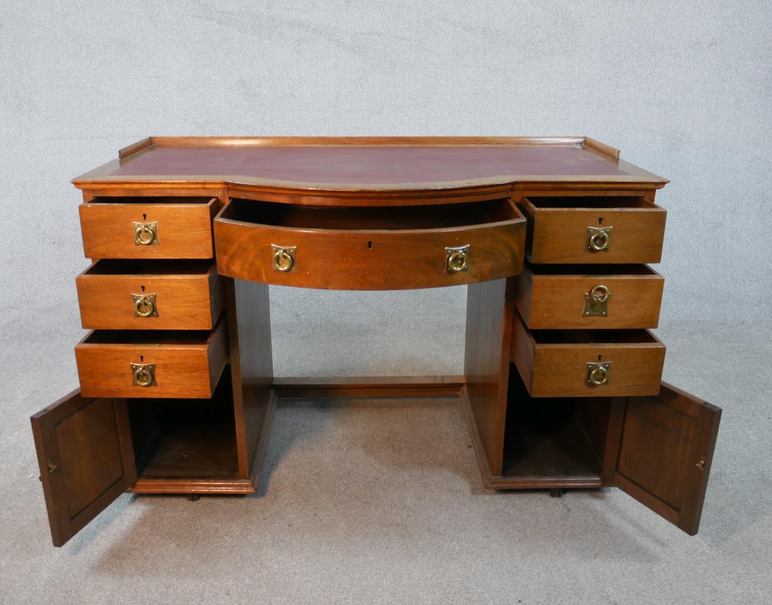 A late 19th century mahogany pedestal desk with bowfronted centre section above drawers and - Image 2 of 5