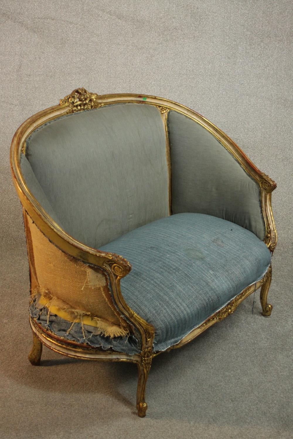 A Louis XV style giltwood canape sofa, with carved cresting and upholstered in blue fabric, with - Image 4 of 7