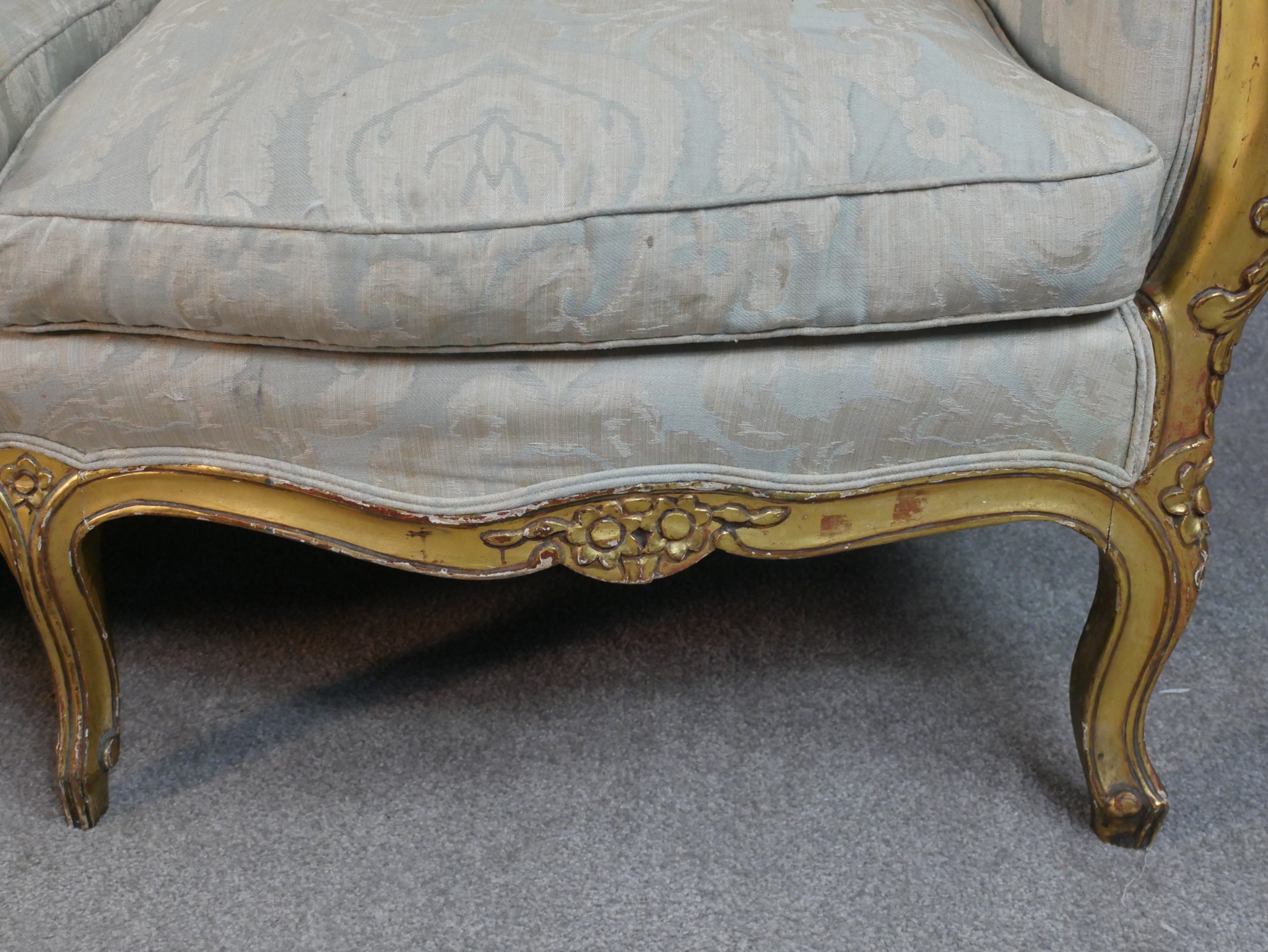 A carved giltwood Louis XV style sofa in floral upholstery on cabriole supports. H.102 W.208 D.76cm - Image 7 of 8