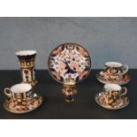 A collection of nine hand painted and gilded Imari and Japan design Crown Derby pieces, including